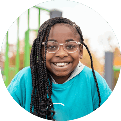 A smiling school age girl in the before and after school care program.   