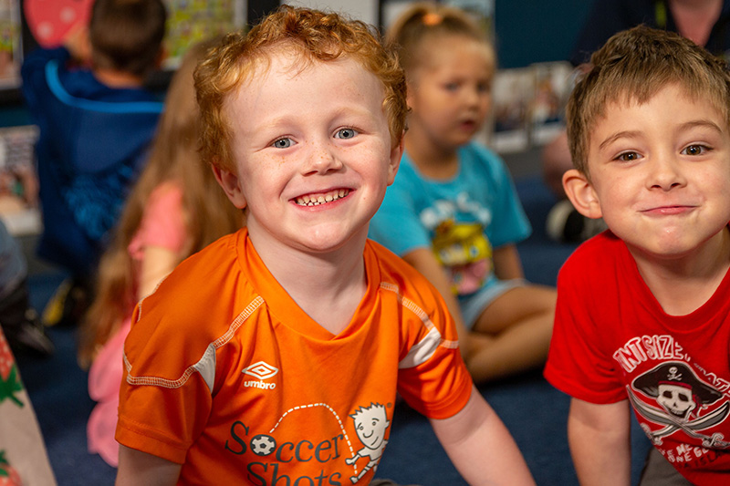 two preschool boys smiling