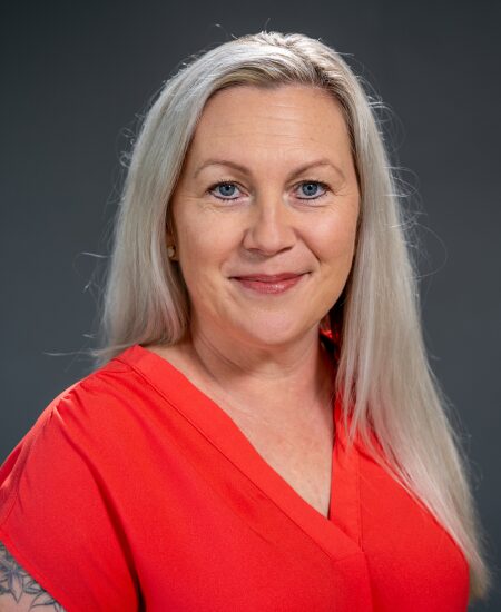 School Director photo. She is a blonde woman outside.