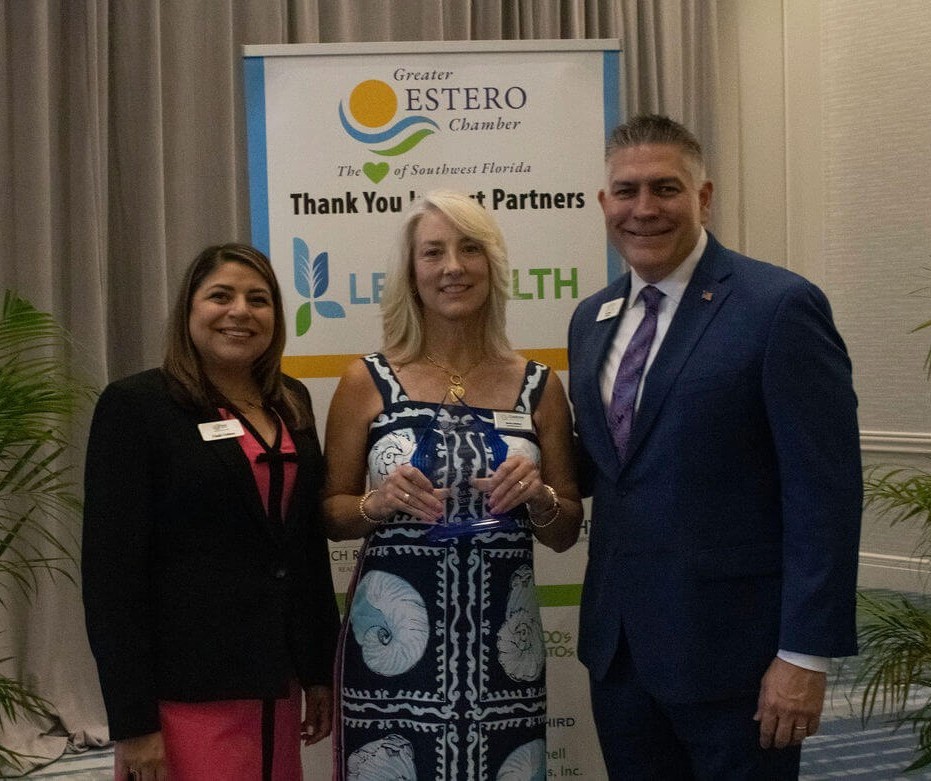 Karen Callahan, owner of Celebree School of Estero, with 2 chamber of commerce members receiving Best Small Business of the Year Award.