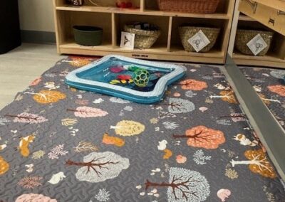 Play mat with toys in a classroom.