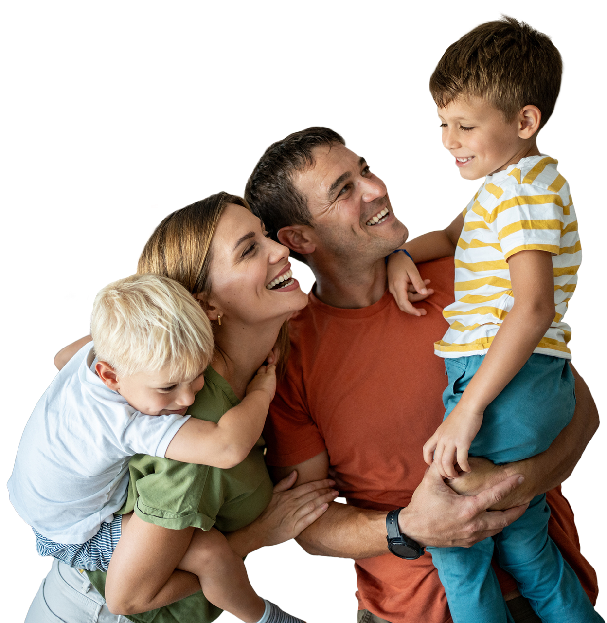 Four-person family sharing a warm group hug and smiling together at home.