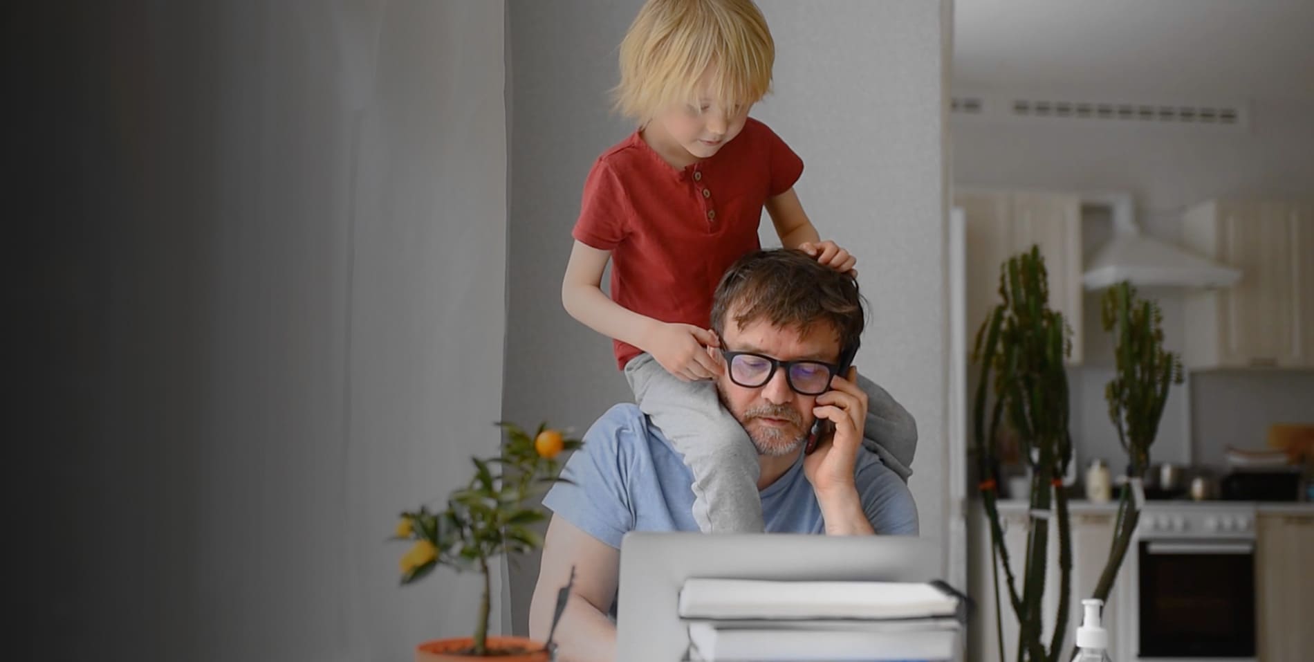 son on dad shoulders